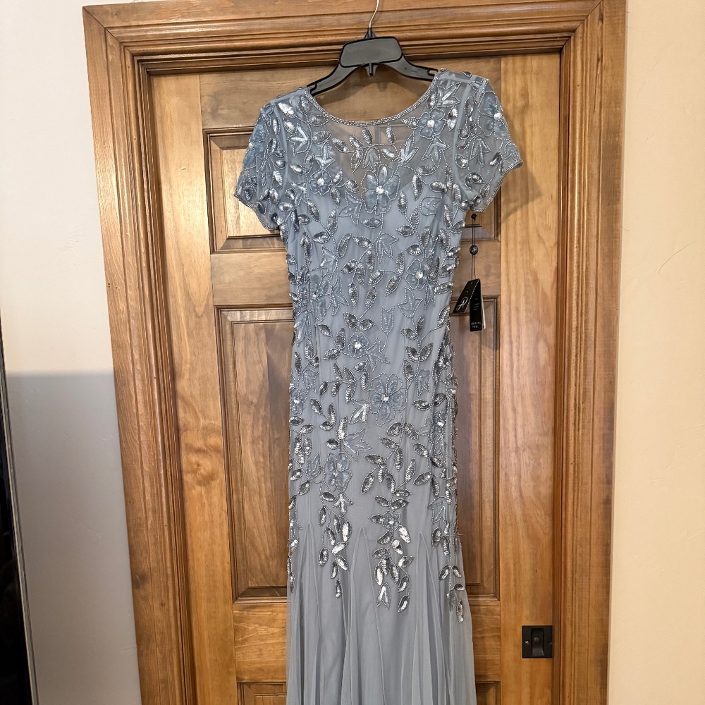 New with tags beautiful beaded slate blue dress.